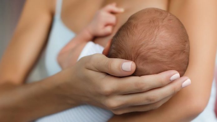 987-breastfeeding-newborn-head-780x439