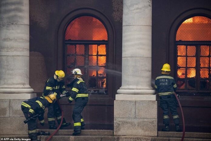 41911312-9484549-The_fire_began_early_on_Sunday_near_a_memorial_to_Cecil_Rhodes_l-a-78_1618769755210-1-899x600-1 (1)