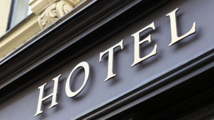 gold-sign-on-exterior-of-hotel-780x439